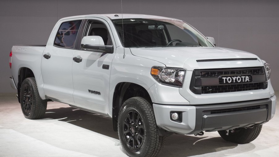 A white Toyota Tundra parked at an auto show.