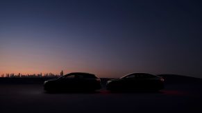The silhouette of an Audi Q4 e-tron in the sunrise