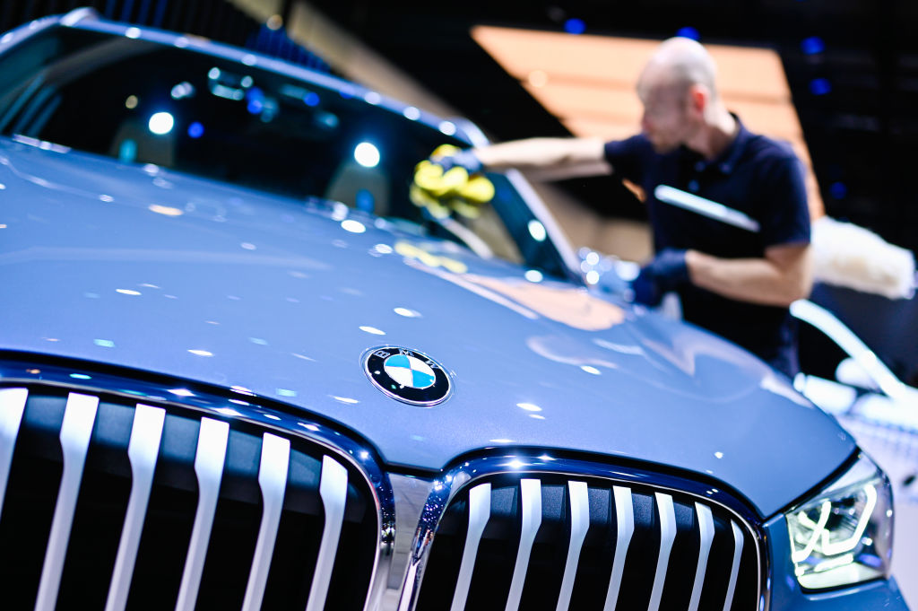 A close up of a blue bmw x1 front end
