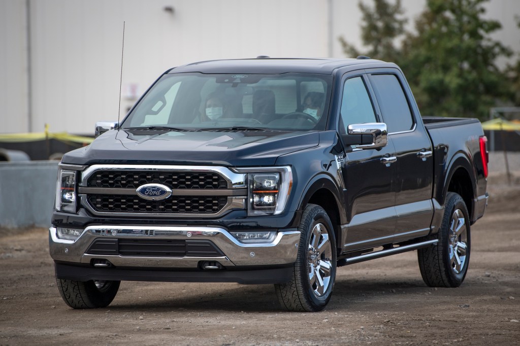The front end of the 2021 Ford F-150 pickup truck on the road