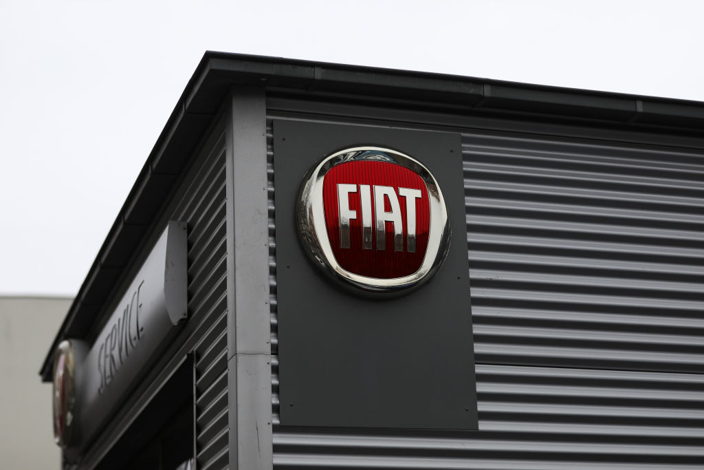 A fiat service building with a large red fiat sign on the side