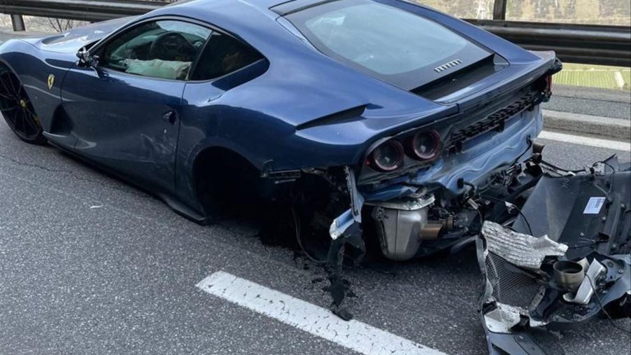 An image of a crashed Ferrari 812 Superfast on the side of the road.