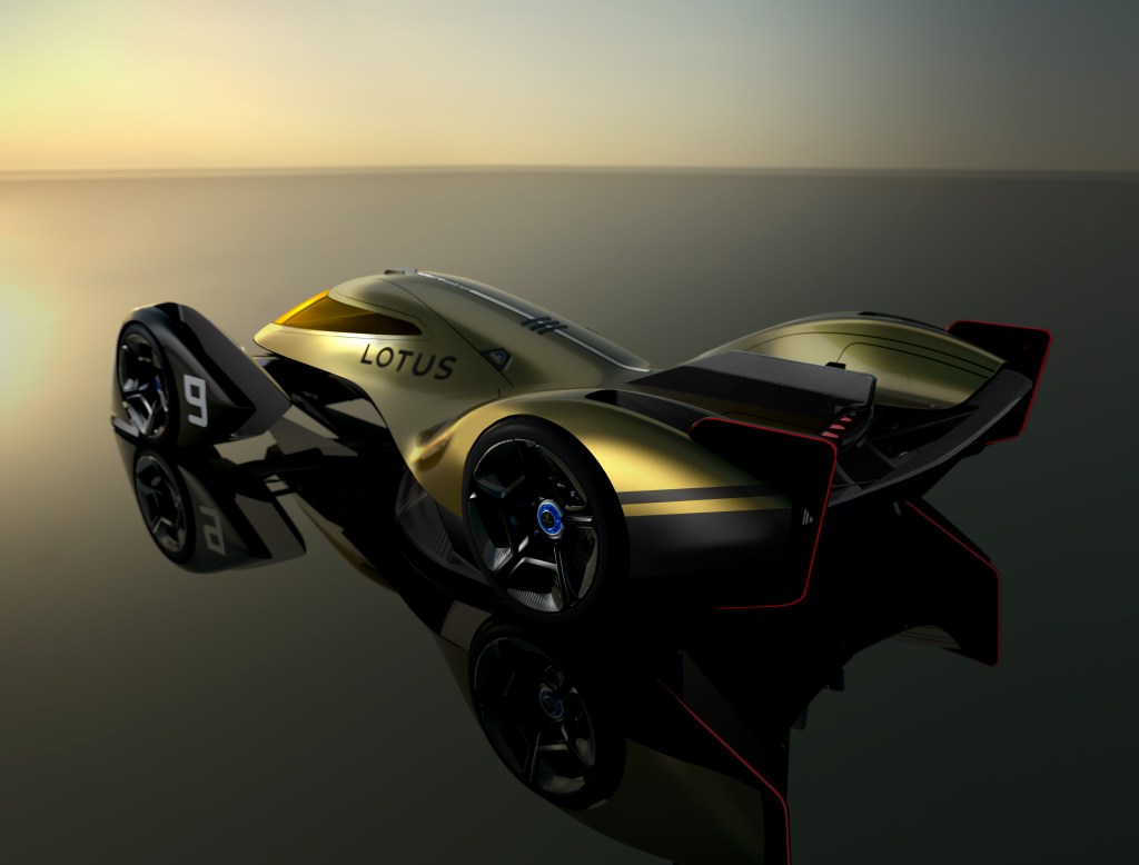 A rear shot showing off the aerodynamics of the new Lotus E-R9 race car in gold and blakc