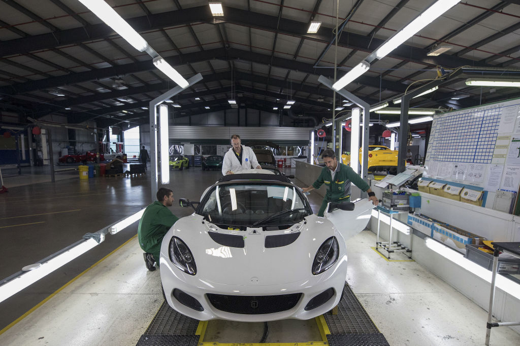 A white Lotus elise on the assembly line 