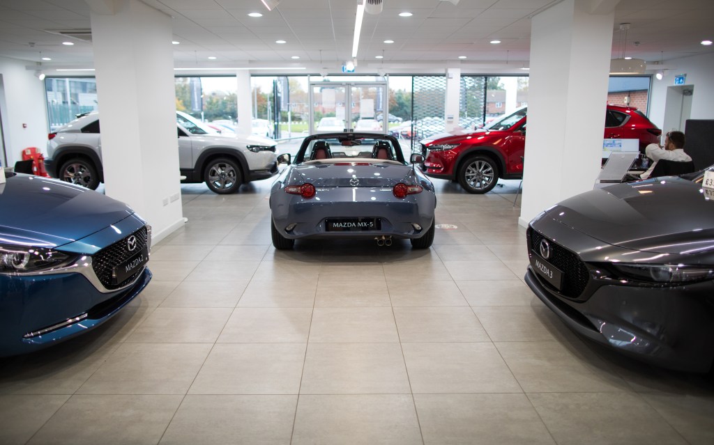 The back end of a mazda mx-5 in a mazda show room