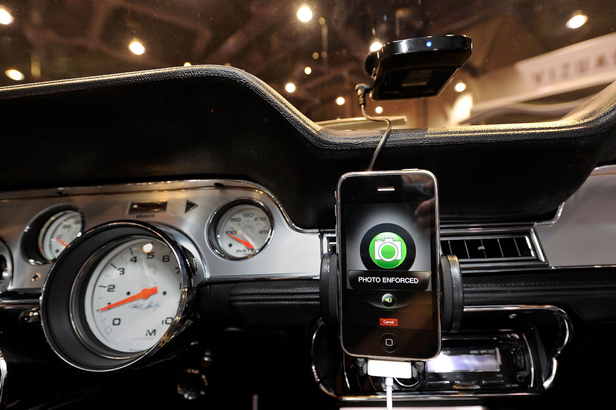 A Cobra iRadar Detection System, consisting of a Cobra radar detector (top) and the Cobra iRadar App for iPhone (bottom), mounted in a 1967 Shelby Cobra GT500 CR at the Specialty Equipment Market Association (SEMA) at the Las Vegas Convention Center in Las Vegas, Nevada, on November 5, 2010