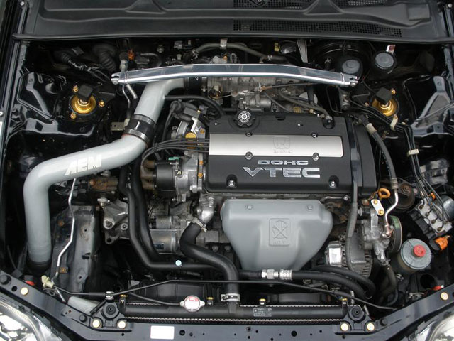 A picture of A Honda Prelude with a wire-tucked engine bay 