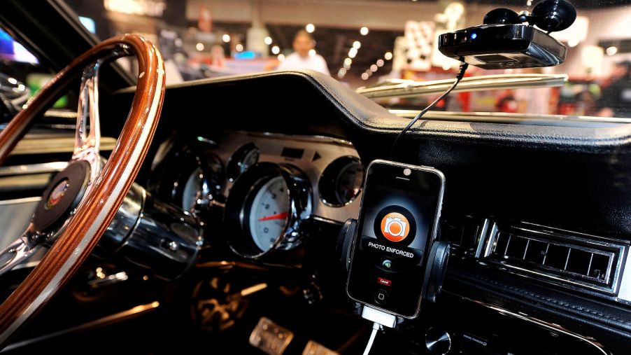 A Cobra radar detector and iPhone app mounted in a 1967 Shelby Cobra GT500 CR