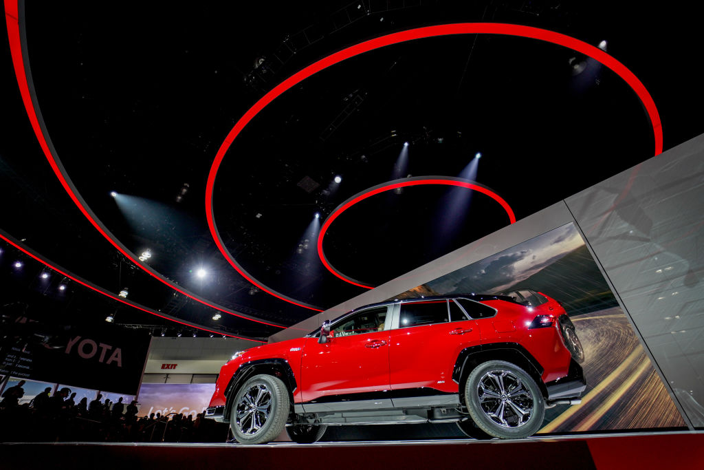 The Toyota Motor Corp. 2021 RAV4 Prime plug-in hybrid sports utility vehicle (SUV) is displayed during a reveal event at AutoMobility LA ahead of the Los Angeles Auto Show in Los Angeles, California, U.S., on Wednesday, Nov. 20, 2019. The RAV4 Prime, a new plug-in hybrid version of Toyotas top-selling SUV, arrives at an opportune time for an automaker thats taken as much flak as any for aligning with the White House in the fight over fuel economy. Photographer: Kyle Grillot/Bloomberg via Getty Images