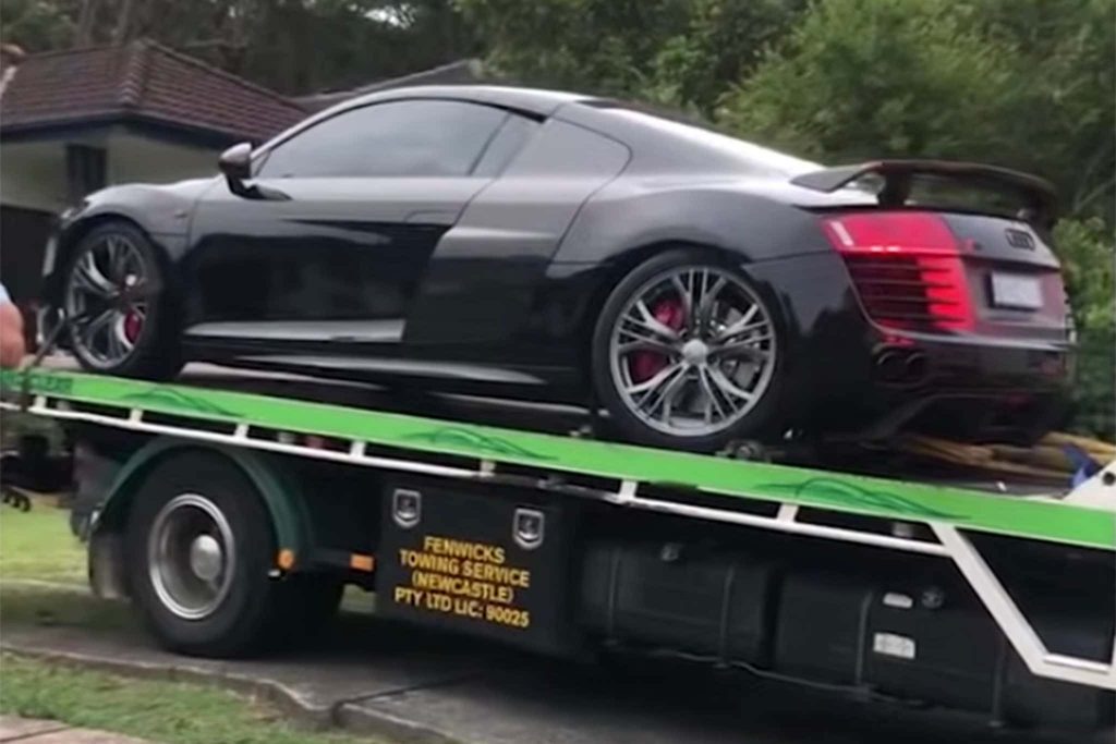 Stolen Audi R8 sitting on the tow truck. The stolen supercar was found with nearly $100k worth of damage. 