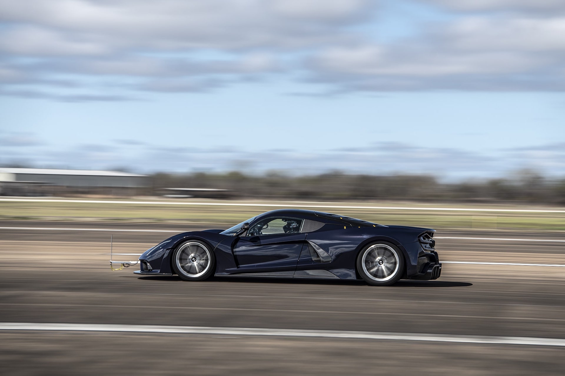 An image of a Hennessey Performance Venom F5 out on a racetrack.