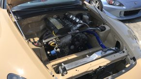 A wire-tucked engine bay in a Honda S2000