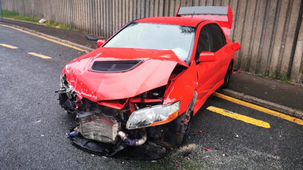 Dream Car Giveaway 2006 Mitsubishi Lancer Evo 9 in red after getting destroyed