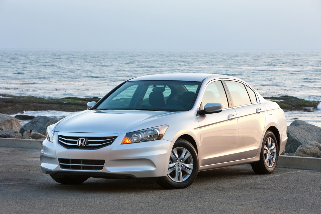 A silver 2011 Honda Accord parked by the waterfront