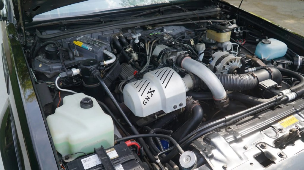 The 3.8-liter turbocharged V6 in the engine bay of a black 1987 Buick GNX