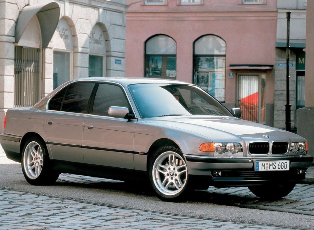 A silver 1999 E38 BMW 740i in a European city
