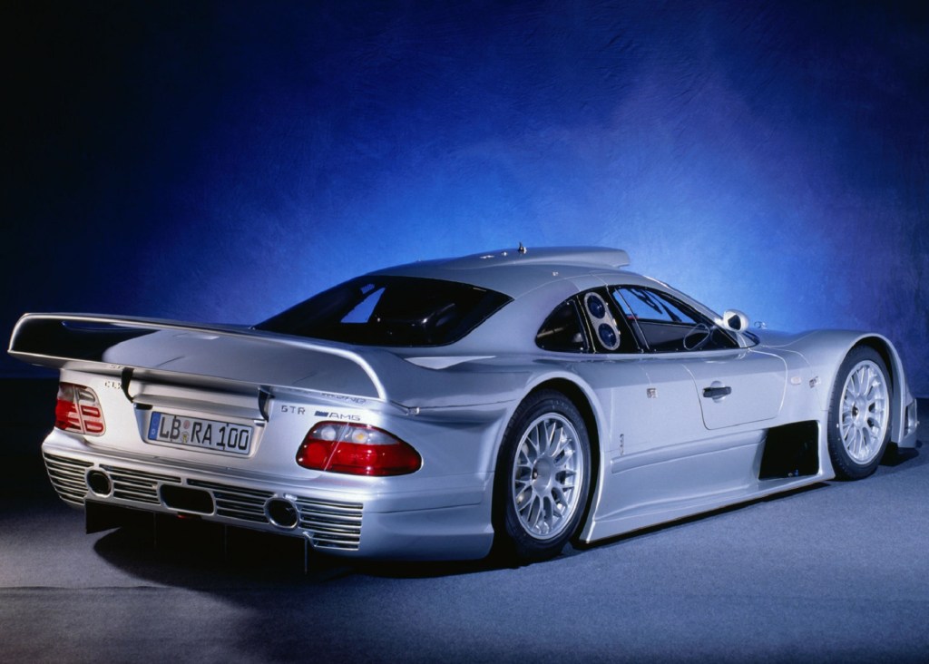 The rear 3/4 view of a silver 1999 Mercedes CLK GTR