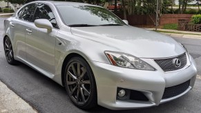 The front 3/4 view of a silver 2008 Lexus IS F parked on the street