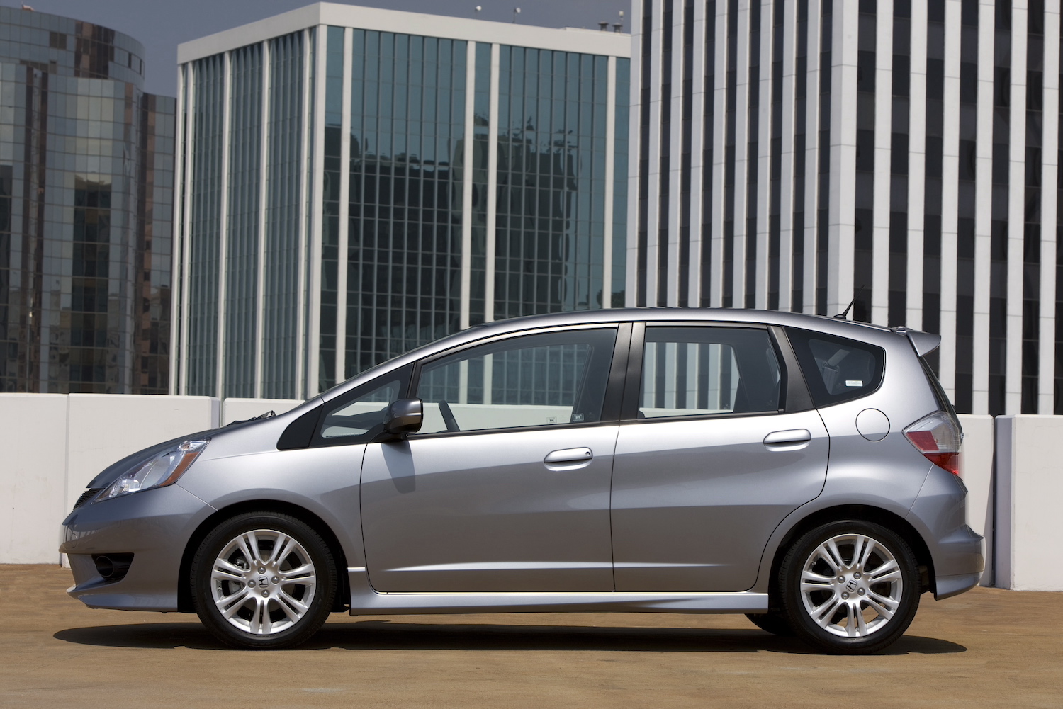 A silver 2009 Honda Fit parked, the Fit is one of the best cheap used cars under $5,000