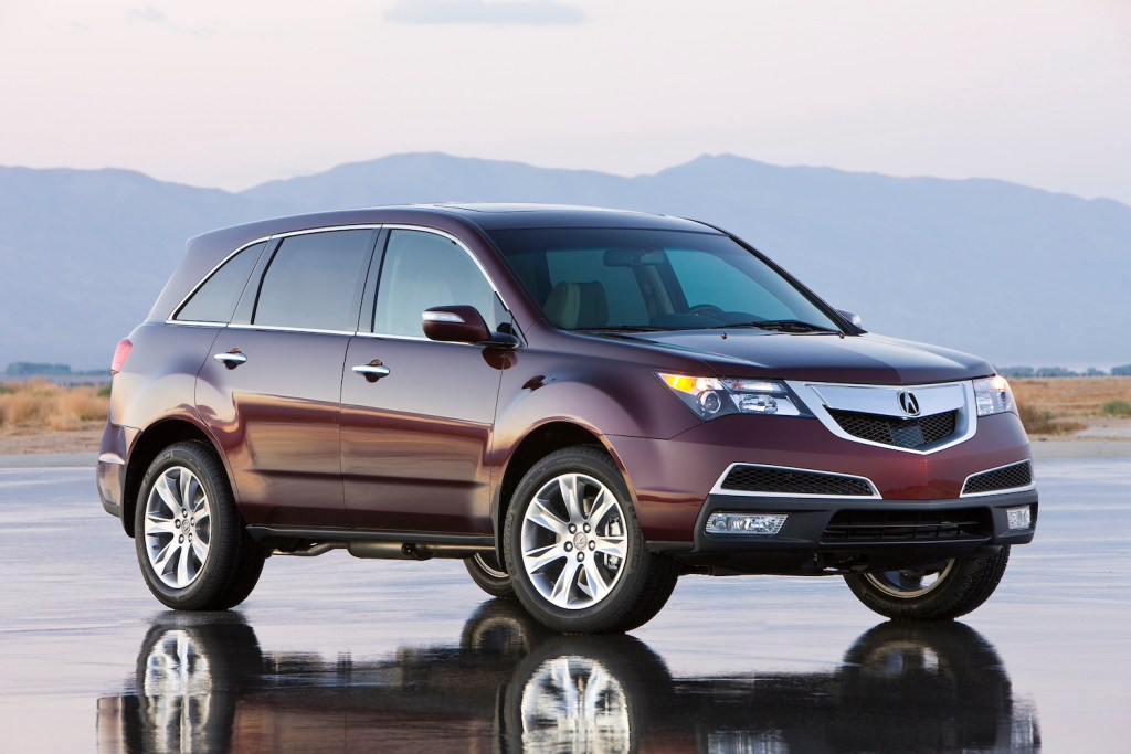 A 2011 Acura MDX parked by mountains