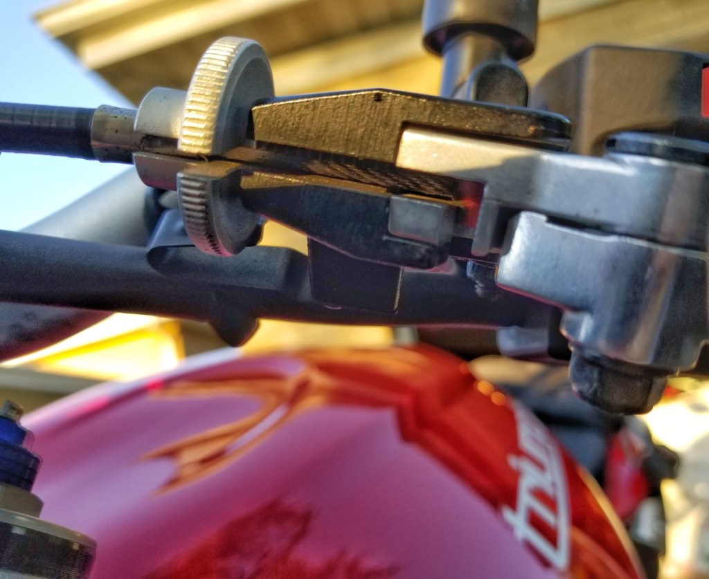 A closeup view of the clutch cable and lever on a 2012 Triumph Street Triple R