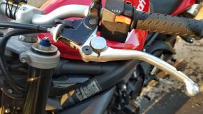 The clutch lever on a red 2012 Triumph Street Triple R