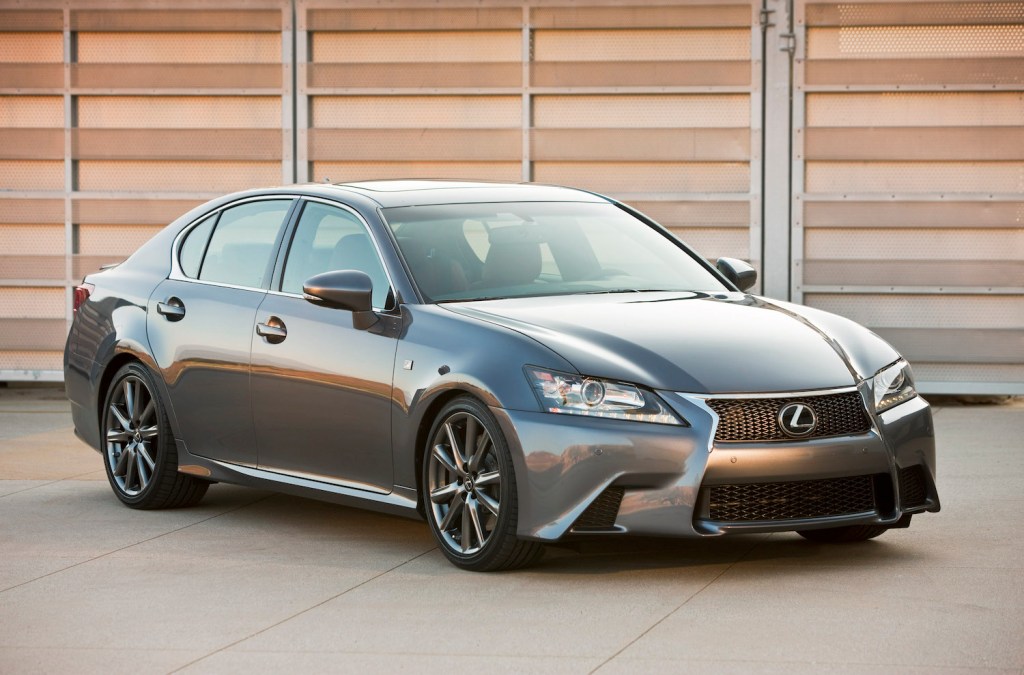 A 2013 Lexus GS parked in front of a garage