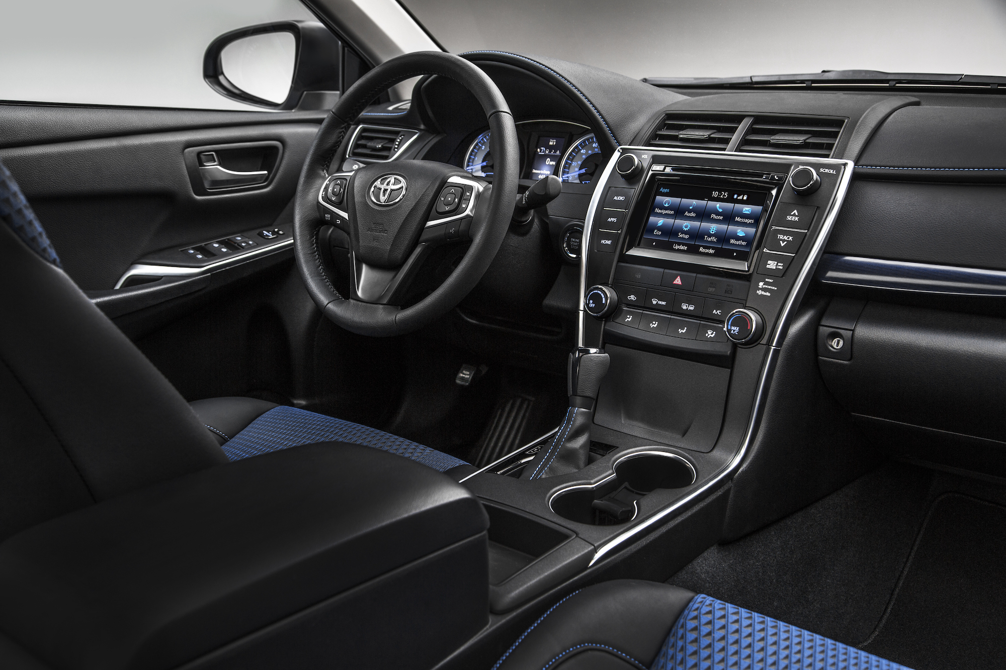 The black and blue interior of a 2016 Toyota Camry midsize sedan