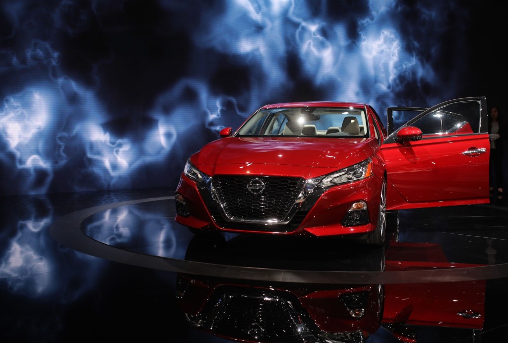 A red 2019 Nissan Altima midsize sedan on display at the New York Autoshow on March 29, 2018, in New York