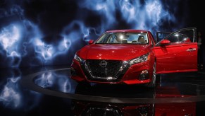 A red 2019 Nissan Altima midsize sedan on display at the New York Autoshow on March 29, 2018, in New York