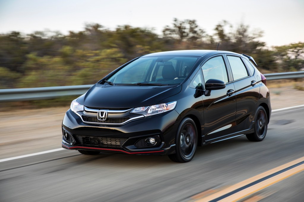 A 2020 Honda Fit driving down a road