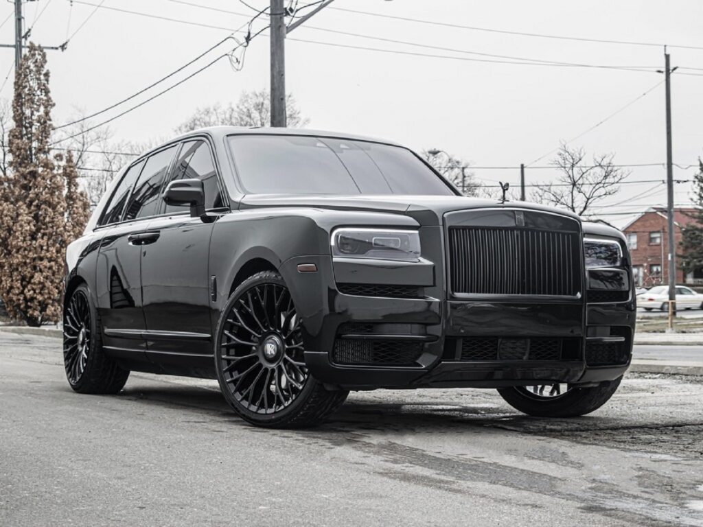 A black 2020 Rolls-Royce Cullinan Black Badge in a parking lot