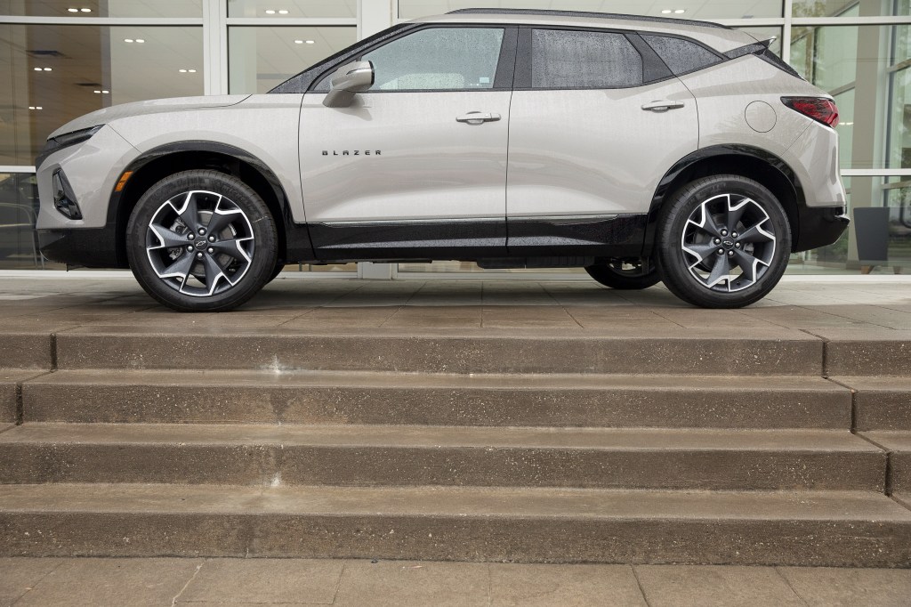 A 2021 Chevy Blazer sits on the stairs of a dealership.