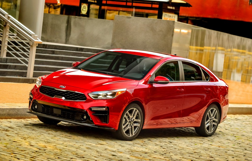 A red 2021 Kia Forte driving