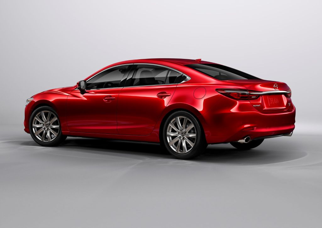 The rear 3/4 view of a red 2021 Mazda 6