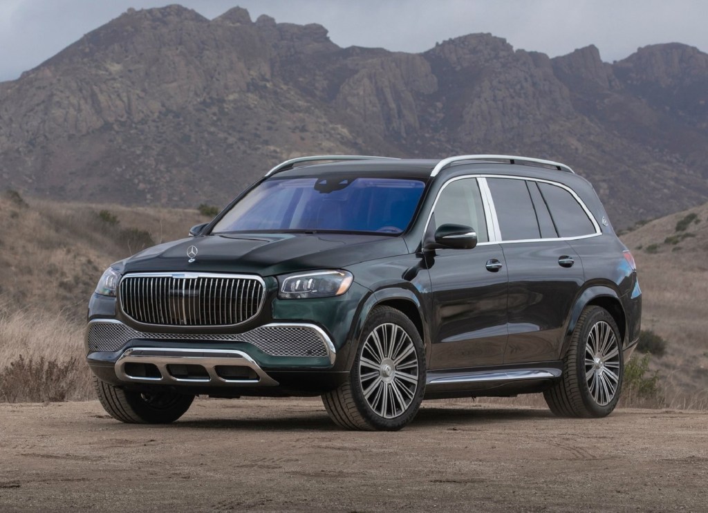 A dark-green 2021 Mercedes-Maybach GLS 600 in the desert next to some mountains