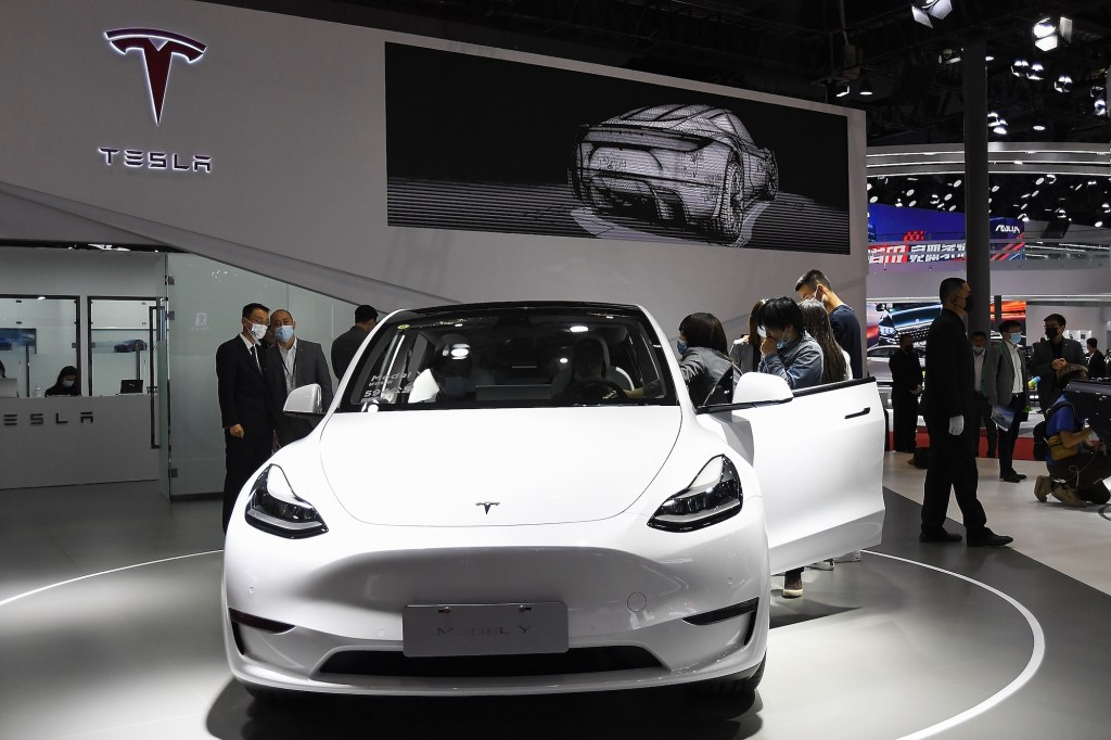 A white Tesla Model Y electric SUV on display at the Shanghai International Automobile Industry Exhibition in April 2021 in Shanghai, China
