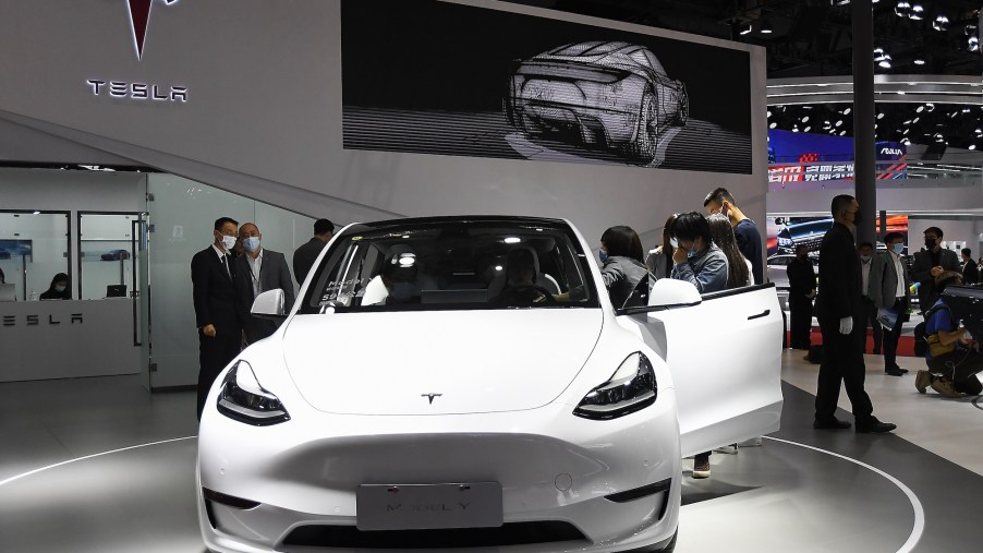 A white Tesla Model Y electric SUV on display at the Shanghai International Automobile Industry Exhibition in April 2021 in Shanghai, China