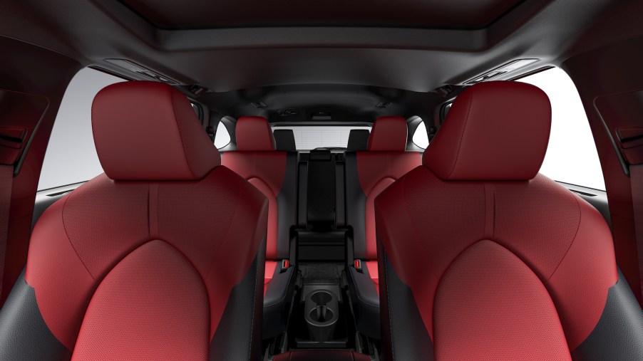 Red and black seating inside a 2021 Toyota Highlander XSE midsize three-row SUV
