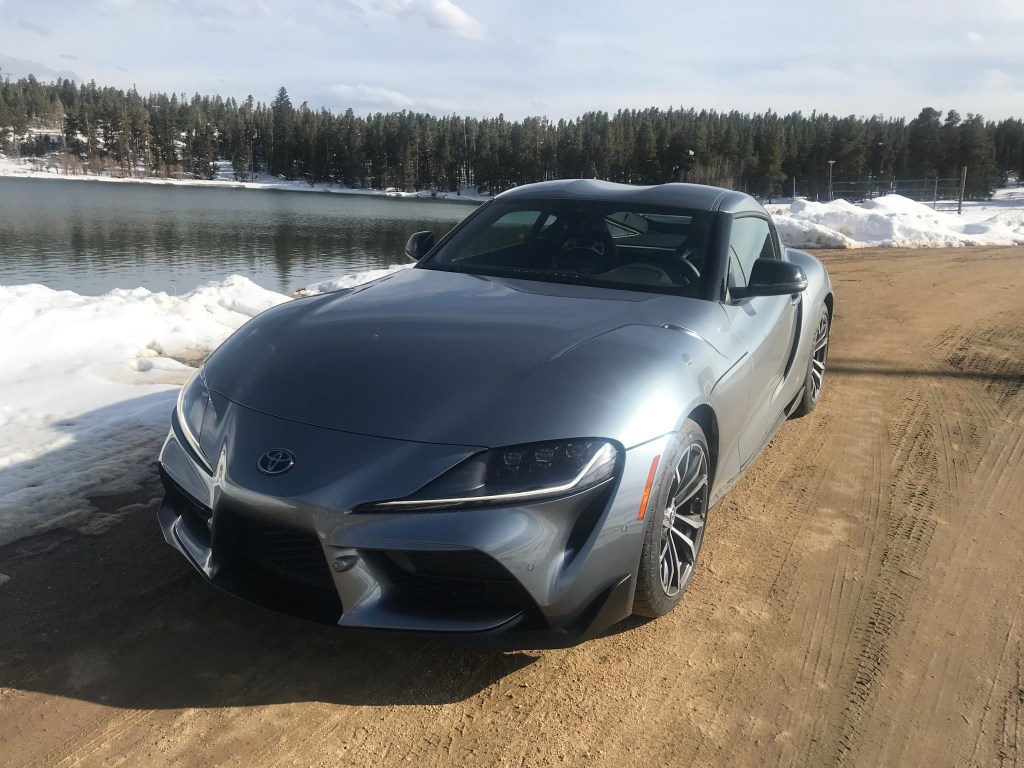 2021 Toyota Supra sitting next to a lake