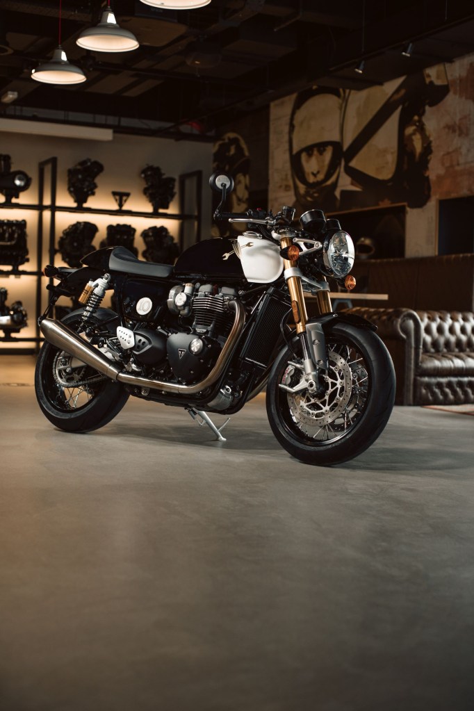 The black-white-and-gold 2021 Triumph Thruxton 1200 RS 10th-Anniversary DGR in a showroom