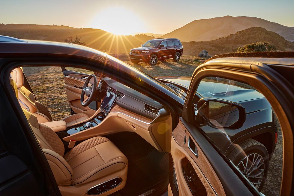 The 2021 Jeep Grand Cherokee L Interior with another model parked in front of it 