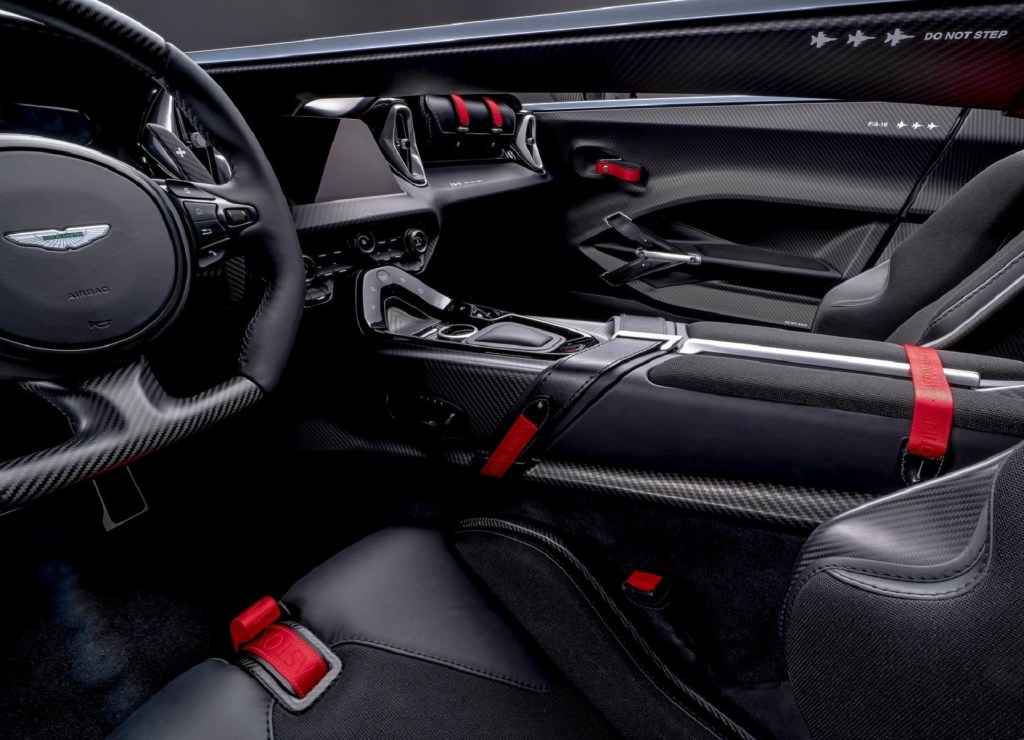 The carbon-fiber-and-leather black-and-red interior of a 2022 Aston Martin V12 Speedster