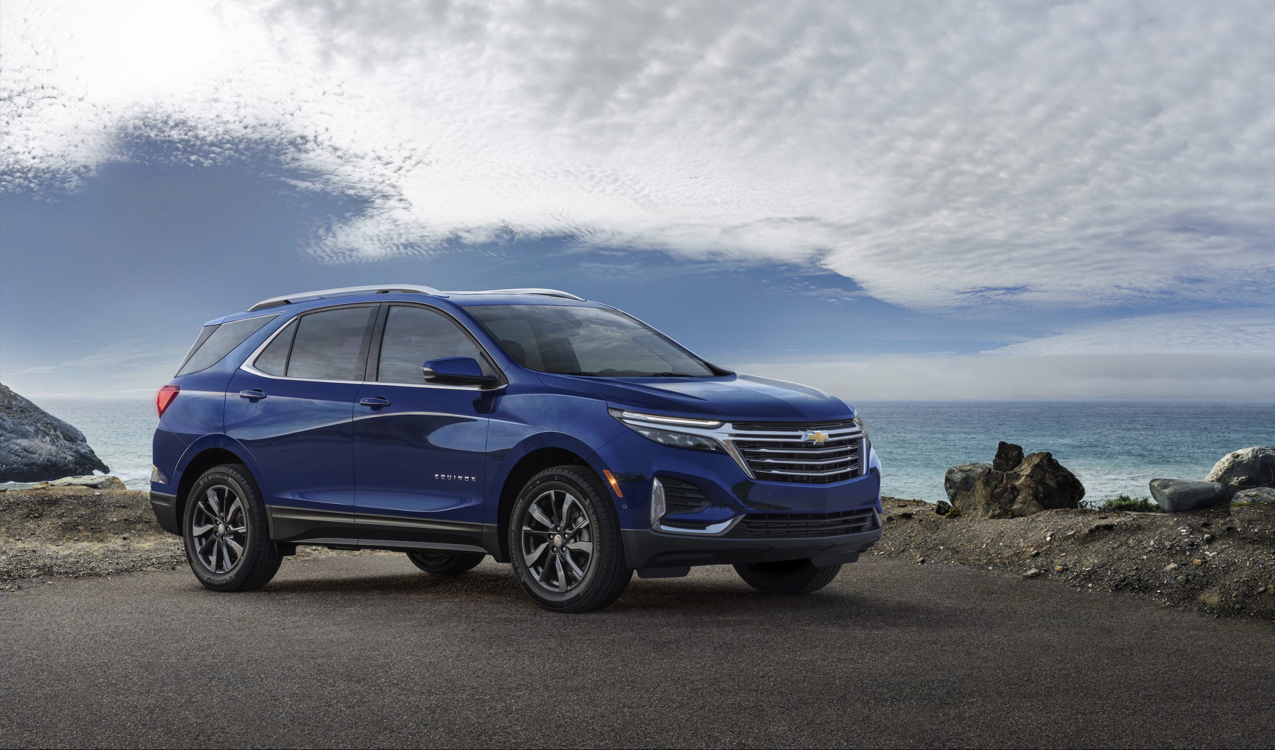 A blue 2022 Chevy Equinox SUV parked on a hill