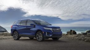 A blue 2022 Chevy Equinox SUV parked on a hill