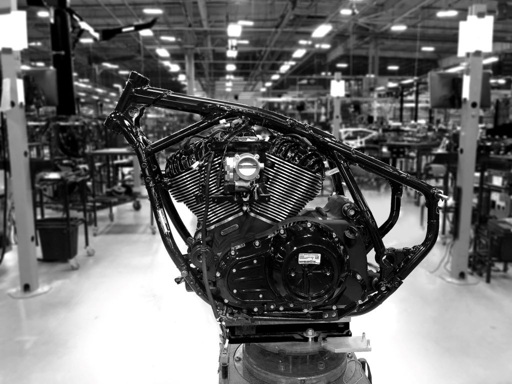 The black frame of a 2022 Indian Chief on a stand with its V-twin installed
