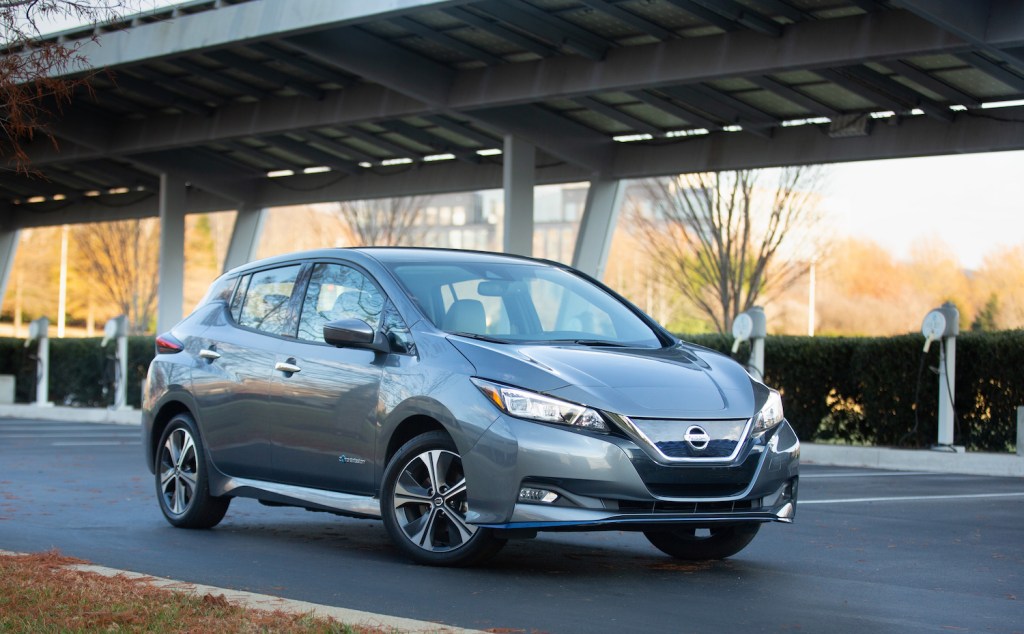 A silver 2021 Nissan Leaf parked on the street, Consumer Reports says the Nissan Leaf is among the best new car deals this Memorial Day