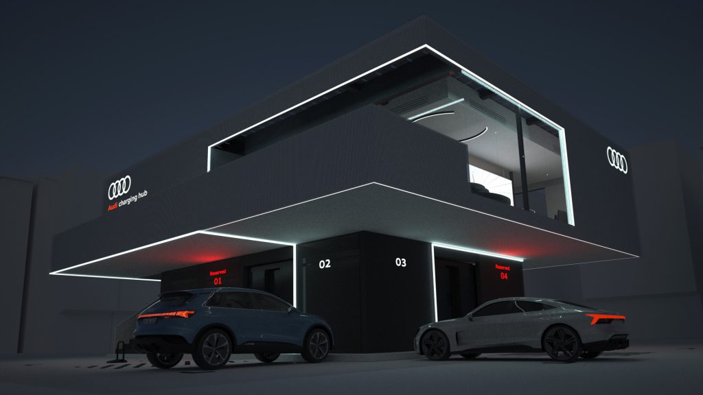 An exterior shot of the German brand's charging hub at night, computer rendered with a few e-tron models parked out front