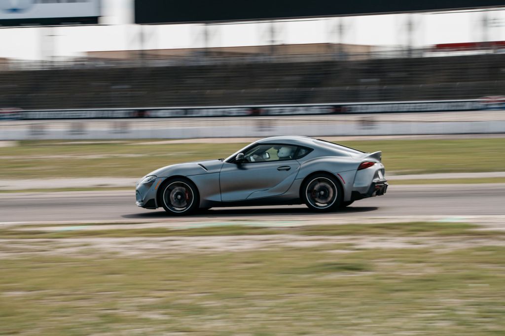 The 2021 Toyota Supra 3.0 side view on the track at speed. 