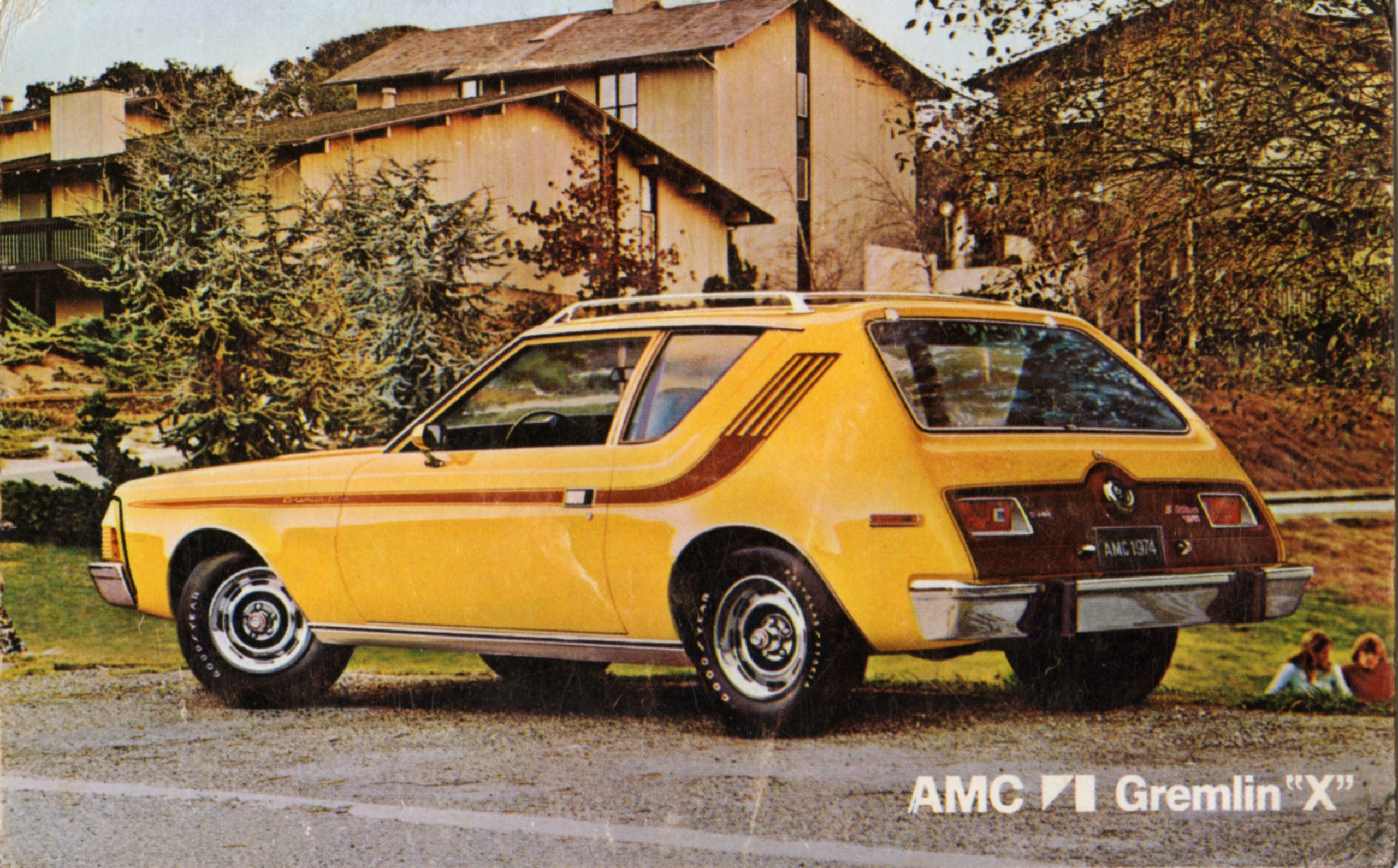 A yellow AMC Gremlin is parked in a 70s suburban neighborhood and ranks in many most hated cars lists